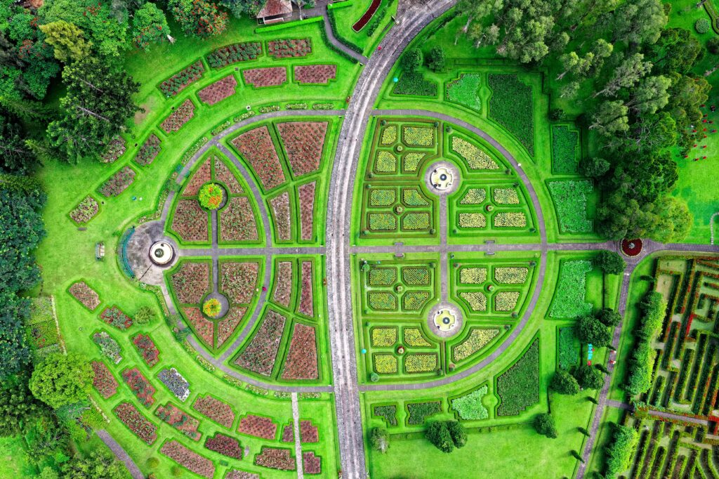 Aerial shot of a vibrant, symmetrical garden layout in Sukaresmi, Indonesia.