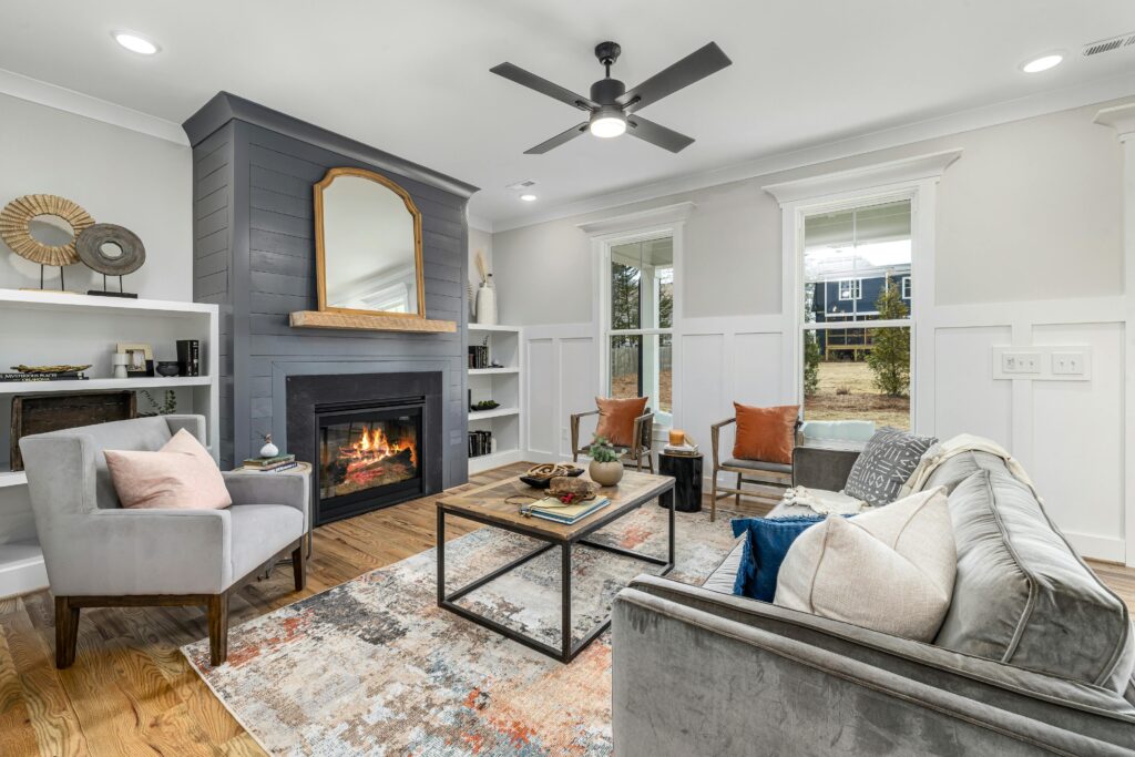 A stylish and comfortable living room featuring a modern fireplace and chic furniture.